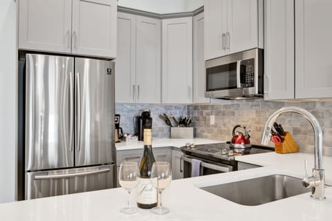 Kitchen fully stocked with everything from gourmet cooking essentials to endless coffee options