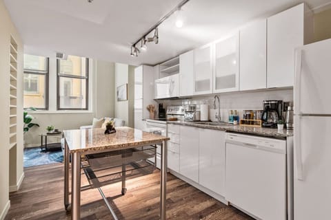 The kitchen’s open layout allows you to move freely as you prepare meals, with everything you need at your fingertips.