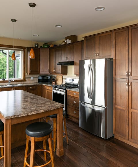 Large Kitchen and Island. Gas range stove 