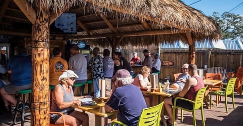 Walk to The Sniki Tiki, a lively local favorite for drinks and live music. Perfect 2BR location in Siesta Key Village.