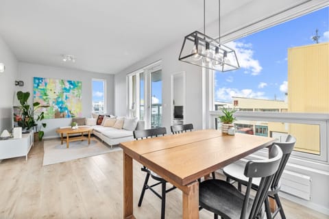 Bask in the natural light that floods through the open-concept living space of this Reykjavik apartment, creating an inviting and airy atmosphere