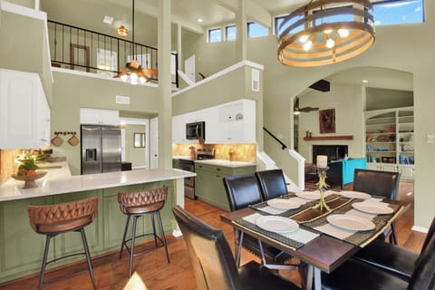 View of the fully stocked kitchen from the attached dining area.