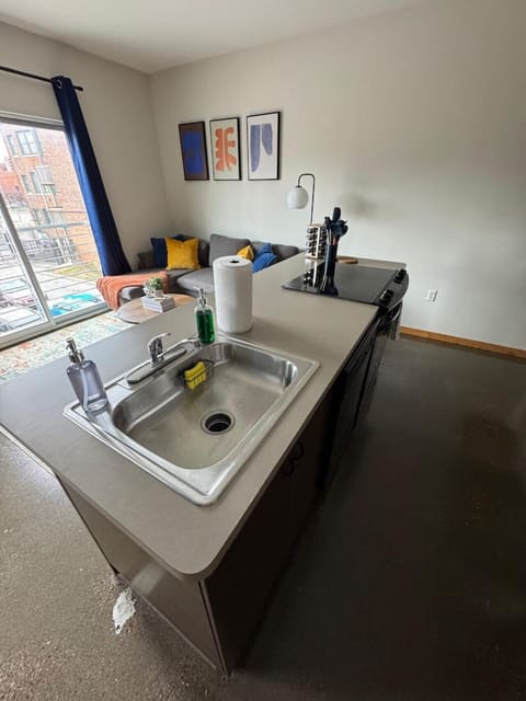 The kitchen’s open layout allows you to move freely as you prepare meals, with everything you need at your fingertips.