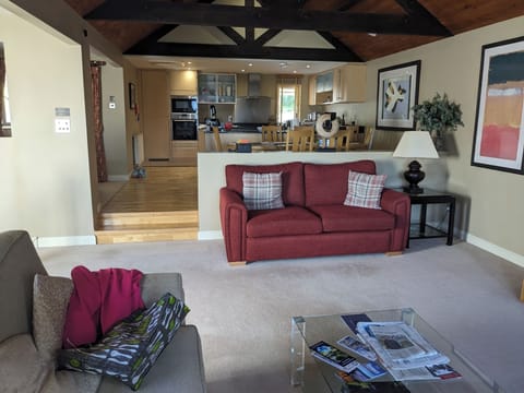 Lounge with dining area and kitchen beyond