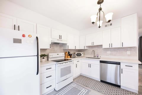 Prepare your favorite meals in this bright and modern kitchen, complete with state-of-the-art appliances, and ample natural light