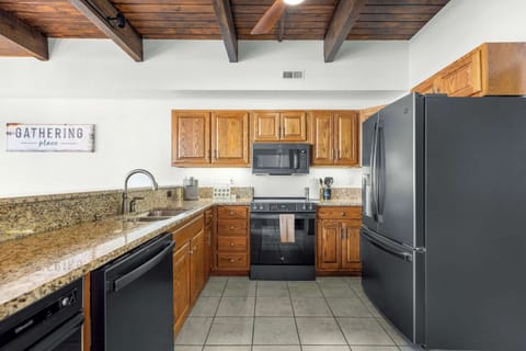 Fully equipped kitchen with everything you need for meals and counter seating for 4