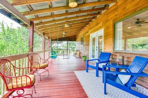 Enjoy the large covered back porch with swings for the kiddos.