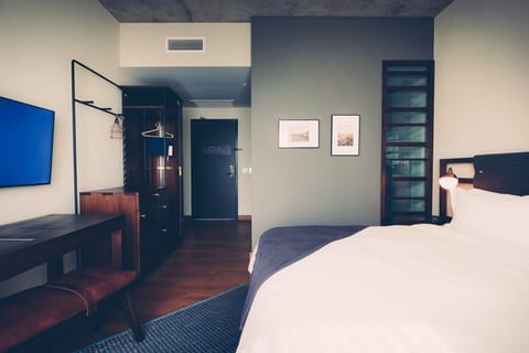 Stretch out in a stylish room with warm wood floors.