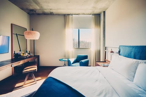 Wake up to soft daylight and a peaceful seating nook.