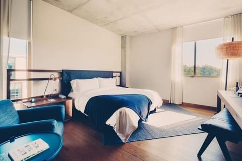 Soak up morning light from bed in a quiet retreat.