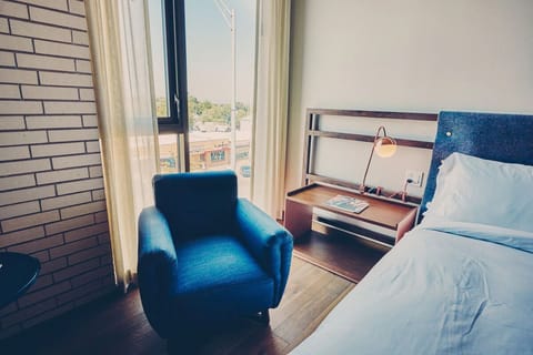 Sip coffee by the window in a plush reading chair.