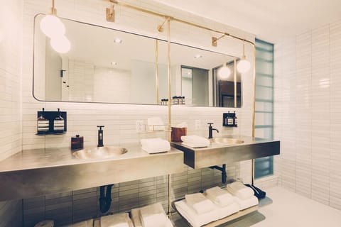 Refresh effortlessly with double vanities and bright, spa lighting.