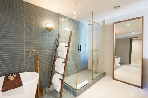Soak or rinse off in a luxe tub-and-rain-shower combo.