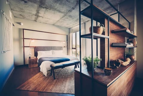 Unwind in crisp linens with calming city-view light.