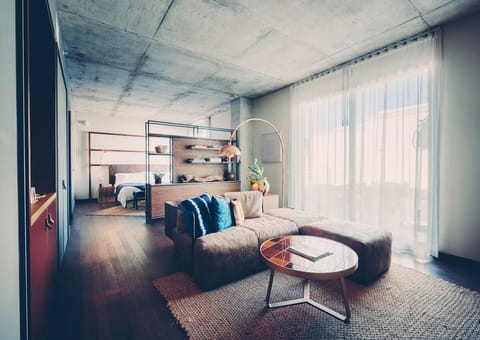 Stretch out in an airy studio with floor-to-ceiling sheers.