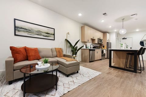 You feel at home as you settle into the living room, where the inviting atmosphere is perfect for lounging or entertaining.