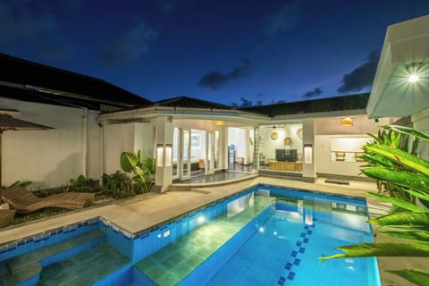 Night view of the pool and garden lighting at Villa Lalebay Seminyak