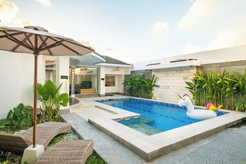 Private swimming pool with sunbeds at Villa Lalebay Seminyak
