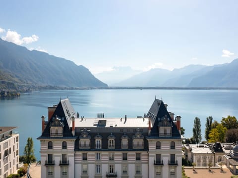 Water, Sky, Cloud, Mountain, Building, Nature, Highland, Lake, Tree, House