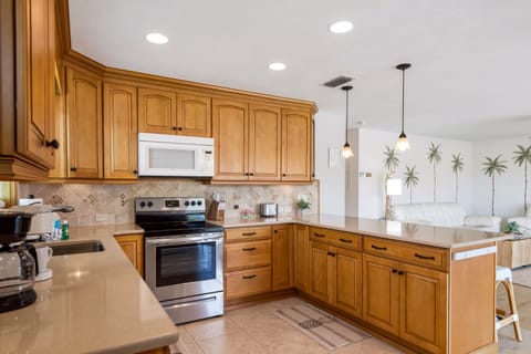Step into this charming, open-concept coastal kitchen.