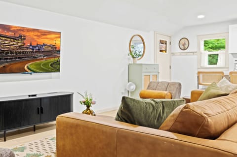 Living Room: Relax and unwind in this spacious open-concept living area, perfect for games and gathering.