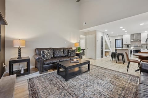 Large windows bring the wooded view inside from the living room