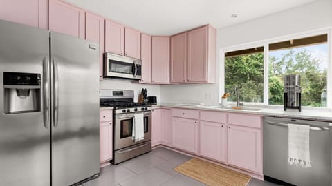 Stylish kitchen with modern silver appliances 