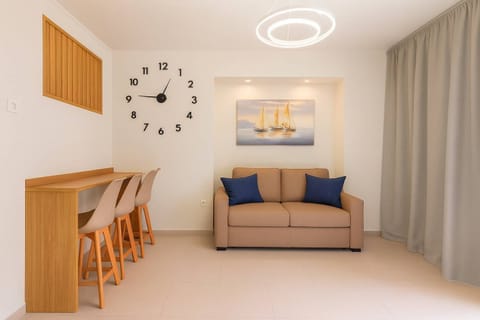 Cozy Living Area with Sofa Bed – Ideal for relaxing or accommodating additional guests.