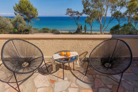 Unwind with a Glass of Wine on the Balcony Overlooking the Deep Blue Sea
A serene spot to relax under the sun or stars, with panoramic sea views and elegant outdoor seating for two.
