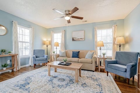 Living space with natural light and comfortable seating.