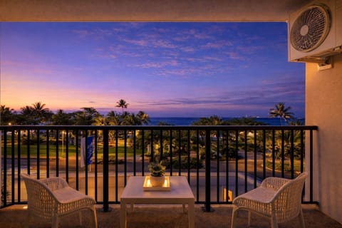 Private balcony with ocean views – enjoy sunset drinks overlooking palm trees and the sea
