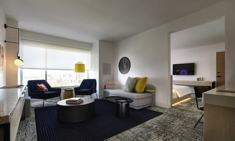 Relax in the airy lounge with city views and plush seating.