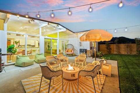 Gather ‘round the fire pit under twinkling lights for the ultimate backyard vibe.