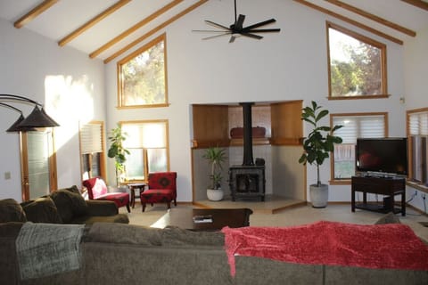 (1st floor) Living room w/large wrap around couch, tv, and seating area