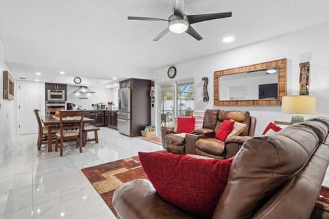 Gather, cook, and relax in this bright and spacious open-concept living area. 