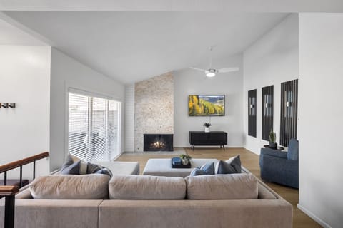 Living Area: Bright and cozy space with comfy seating and a TV for relaxing.

