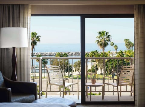 Sip morning coffee on the balcony overlooking palms and ocean.