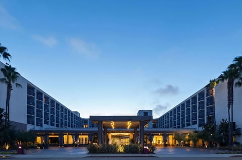 Unwind at dusk as the entrance glows with calm energy.