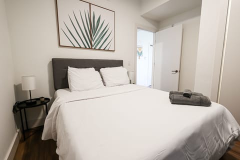 Unwind in comfort with quality bedding and thoughtful lighting.
