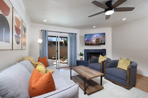 living room with comfortable seating, smart TV and access to back patio