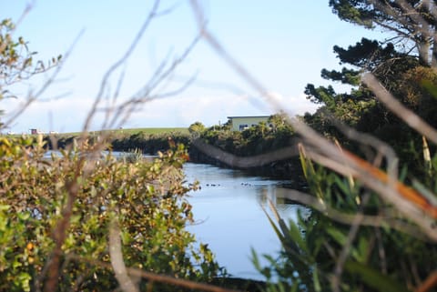 View from Hokitika River Bridge towards Hoki Boatshed Holiday Accommodation.