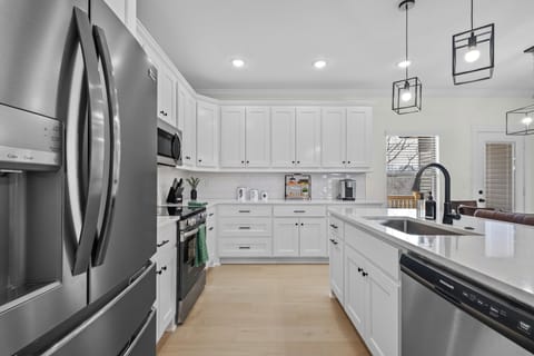 Fully stocked kitchen for your cooking & baking needs & seating for 3 at bar!