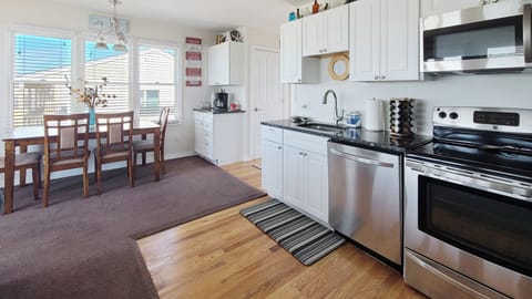 Nicely equipped galley kitchen with stainless appliances