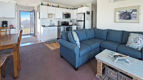 Living room with ktichen and dining area beyond