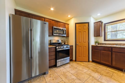 Kitchen - Fully equipped kitchen with refrigerator, range and dishwasher