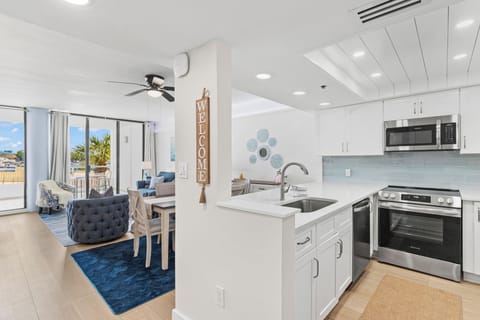 This modern coastal kitchen invites you to cook, gather, and unwind, with sleek finishes, ocean-inspired details, and all the comforts of home.