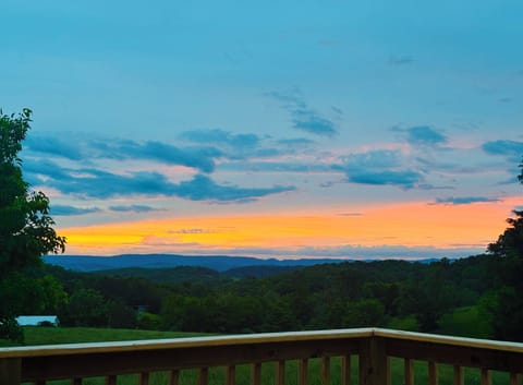 The gorgeous views of mountains, farms, cows, horses, and sunsets!