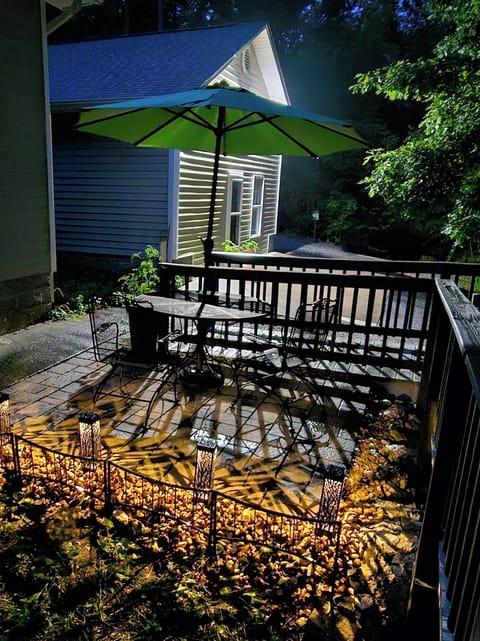 Outdoor Patio with Exterior Lighting at Night