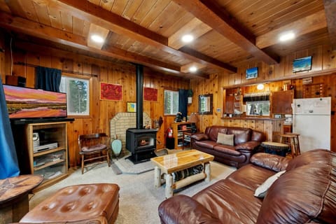 Main floor with living area, kitchen and dining table.