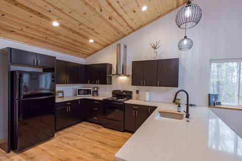 Fully equipped kitchen — perfect for cooking your favorite meals and gathering around!